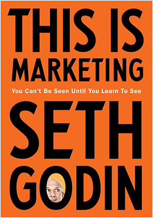 Šis ir Seta Godina vāka “This Is Marketing” vāks. Vāks ir vertikāls taisnstūris ar oranžu fonu un melnu tekstu. Seta galvas fotoattēls parādās viņa uzvārda burtnīcā.